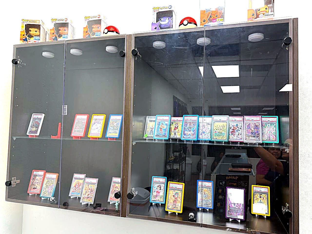 Tower display case of graded card slabs